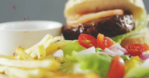 Red symbols appearing, camera shifting right upward, burger and fries showing Stock Footage 323336090