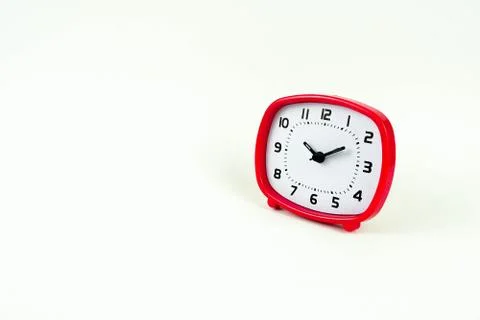  red table alarm clock isolated over white. Stock Photos