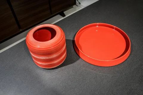 Red tableware on loft stylish table background Stock Photos