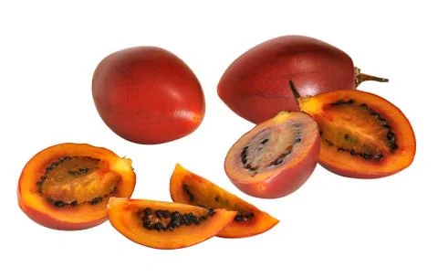 Red tamarillo fruit with cross sections showing ripe flesh and seeds Stock Photos