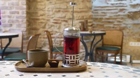 Red Tea: Cozy Table Setup with Steaming Brew Video stock 343551682