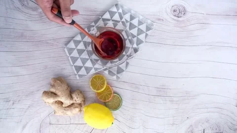 Red Tea with Lemon and Ginger: Healthy Infusion Stock-Footage 343657942