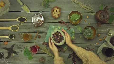 Red tea made from rose petals on an old wooden table. Flat lay. Video stock 156328171