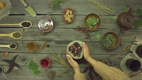 Red tea made from rose petals on an old wooden table. Flat lay. Stock Footage 156328259