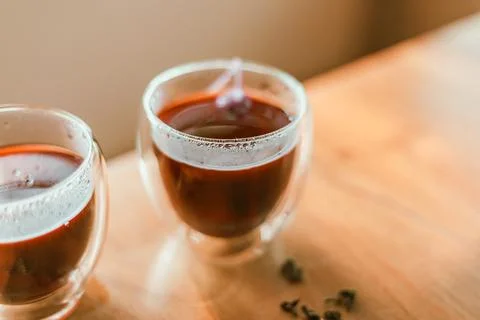 Red tea or called  Dragon blood tea  in the small clear glass Foto stock