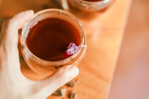 Red tea or called  Dragon blood tea  in the small clear glass Stock Photos