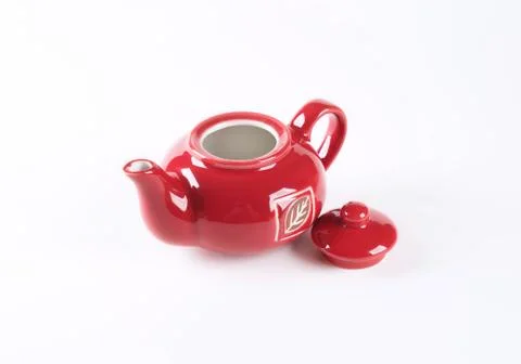 Red tea pot on white background Stock Photos