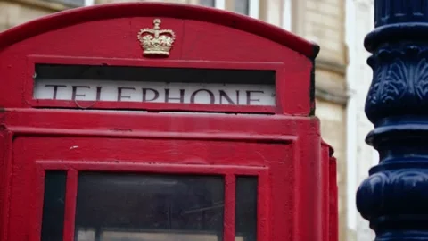 Red telephone booth in Britain Stock Footage 254584475