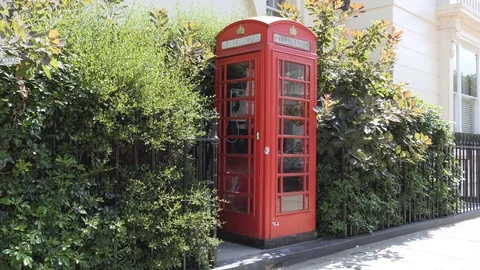 Red telephone booth. Stock Footage