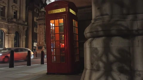 A red telephone booth at night. Stock Footage 116677258