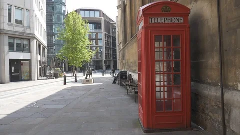 A red telephone booth on the streets of central London. Video stock 107950889