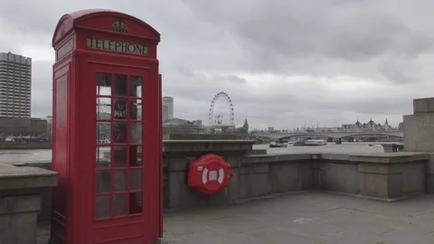 Red telephone booth on the waterfront. Stock Footage 74291232