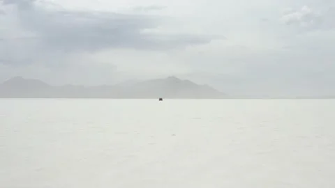 Red Tesla Model 3 drifting in Bonneville Salt Flats Stock Footage 132592223
