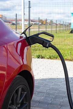 Red Tesla Model 3 is super fast charging Foto stock
