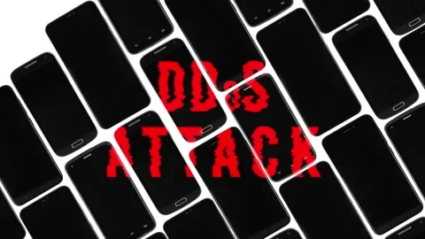 Red text DDoS attack appears on black smartphones, seamless looping, title intro Video stock 130493812