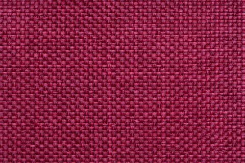 Red textile background with checkered pattern. Structure of fabric macro. Stock Photos