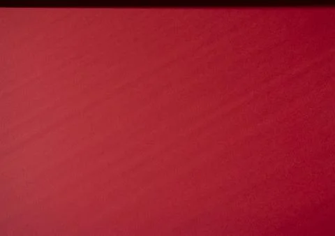 Red texture paper background with shadows. Copy space for text. Flat lay, top Stock Photos