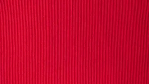 Red textured background with vertical stripes of furrows Stock Photos