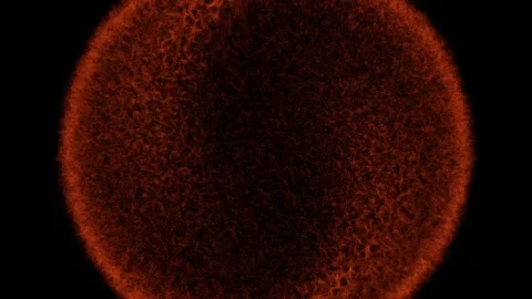 Red textured object transitions from dark to light on black surface Stock Footage 328218597