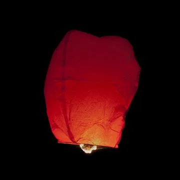 Red Thai sky lantern in mid-air Fotos de archivo