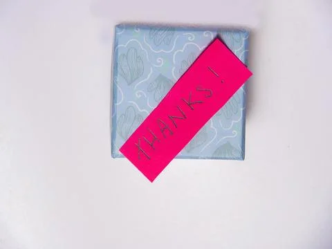 Red Thank You Post-it Note on a gift box on a pink background Stock Photos