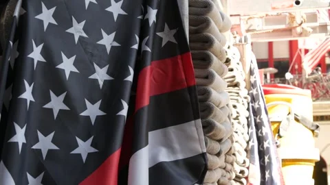 Red thin line black american flag on firefighter 911 truck. Firetruck and fire Stock Footage 329501734
