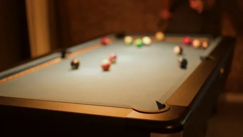 Red thirteen pool ball falls into corner pocket during casual billiard game.. Stock-Footage 332825439
