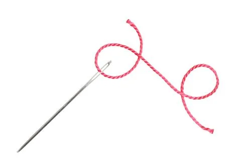 Red thread and needle isolated on white 库存照片