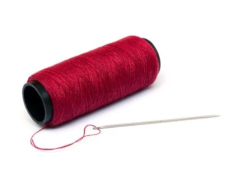 Red thread and needle. Stock-Fotos