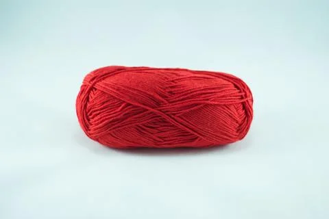 Red thread ball on white background Foto stock