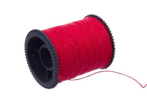 Red thread on black plastic spool Stock Photos