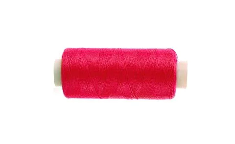 Red thread bobbin isolated on white background Fotos Stock