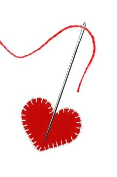 Red thread, needle and heart isolated on white Stock Photos