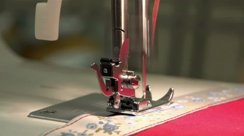 Red thread stitch sews on the sewing machine braid fabric Stock Footage 67846790
