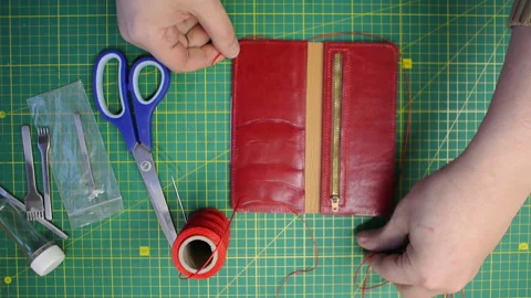 Red thread stitching leather red wallet DIY craft 스톡 동영상 148047955