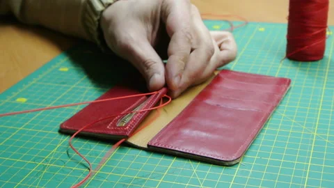 Red thread stitching leather red wallet DIY craft 스톡 동영상 148048002