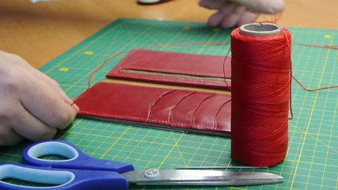 Red thread stitching leather red wallet DIY craft 스톡 동영상 148048046
