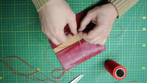 Red thread stitching leather red wallet DIY craft 스톡 동영상 148048109