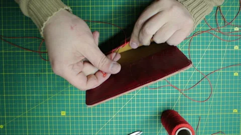 Red thread stitching leather red wallet DIY craft 스톡 동영상 148048132