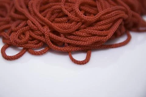 Red threads on white background close-up Stock Photos