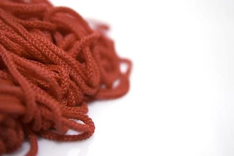 Red threads on white background close-up Stock Photos