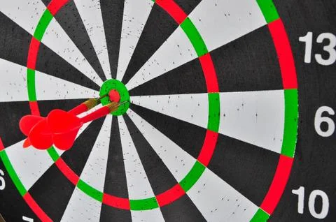 Red three darts arrows in the target center business goal concept Stock Photos
