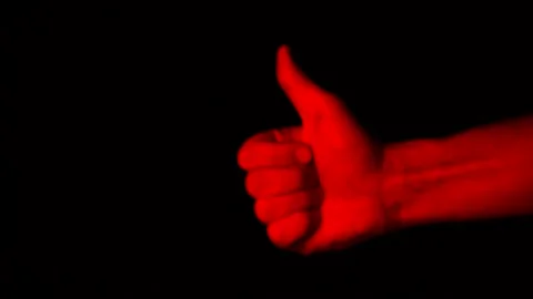 Red thumb up isolated on black background. Stock Footage 122126892
