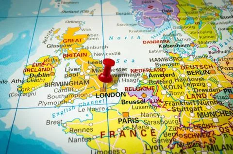 Red thumbtack in a map, pushpin pointing at London city Stock Photos