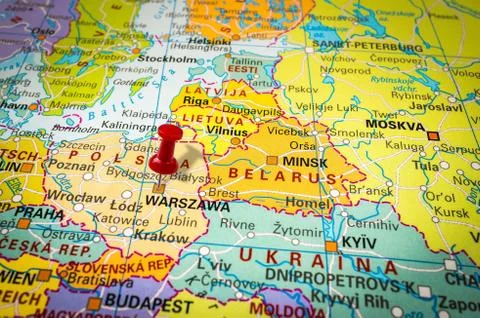 Red thumbtack in a map, pushpin pointing at Warsaw city Stock Photos