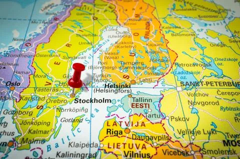 Red thumbtack in a map, pushpin pointing at Stockholm city Stock Photos