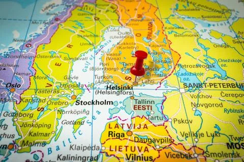 Red thumbtack in a map, pushpin pointing at Helsinki city Stock Photos