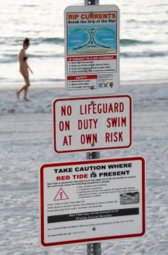 Red tide and rip current sign. Stock Photos