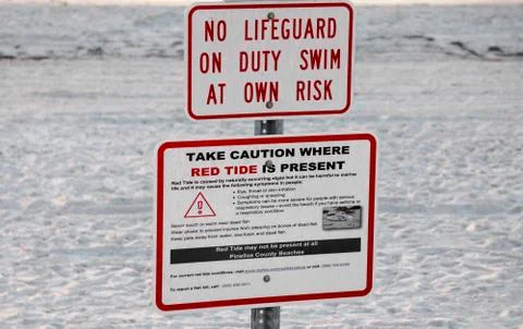 Red tide and rip current sign. Stock Photos