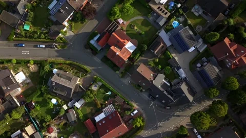 Red-tile rooftops surround quiet street intersection in small German Stock Footage 340566121